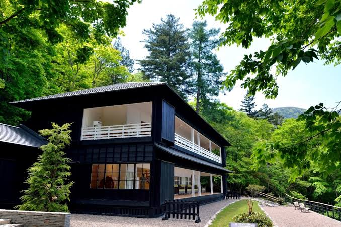 The black-walled Italian Embassy Villa set in the forest